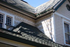 Two different shingle patterns on the body of the house and the gable.